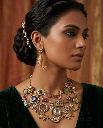 Boho style Indo-Western necklace set with intricate gold-tone detailing and colorful gemstone accents, designed for a statement ethnic look.