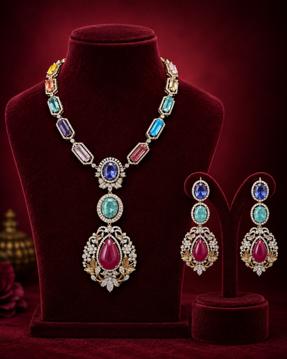 This set includes a necklace and matching earrings featuring multicolor gemstones, designed to provide coordinated accentuation for formal and casual attire. The varied gemstone hues allow versatility in styling with diverse color palettes
