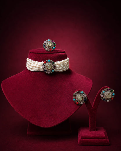 Multicolor choker necklace set with matching earrings and ring, featuring vibrant gemstones and intricate detailing.