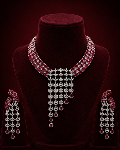 The Ruby Drapes Diamond Necklace Set combines natural rubies with precisely cut diamonds, offering durable craftsmanship and balanced weight. This set provides both aesthetic elegance and structural integrity, suitable for formal occasions requiring refined gemstone jewelry.