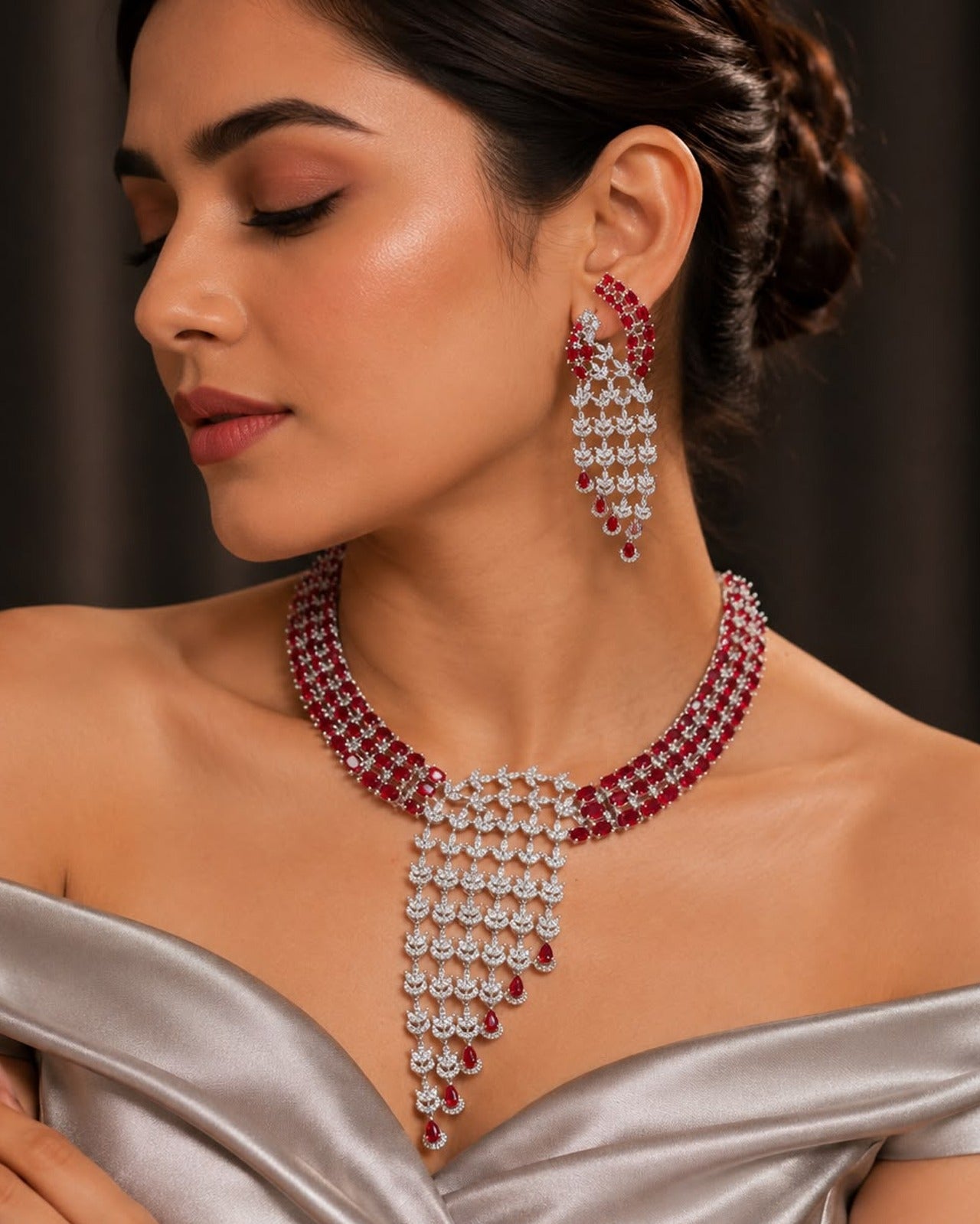 The Ruby Drapes Diamond Necklace Set combines natural rubies with precisely cut diamonds, offering durable craftsmanship and balanced weight. This set provides both aesthetic elegance and structural integrity, suitable for formal occasions requiring refined gemstone jewelry.